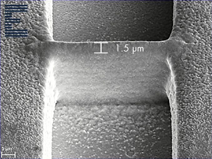 A 3D printed copper bridge connecting a semiconductor open defect, diameter of 1.5 μm.