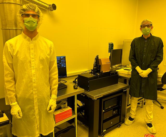 Nikolas Roeske, Process Equipment Engineer at Georgia Tech, and Riccardo Conte, Exaddon R&D Engineer, stand next to the CERES system.