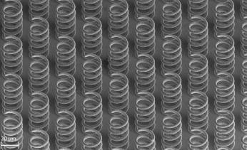 An SEM image of a fine-pitch array of metal microcoils, 3D printed by Exaddon.